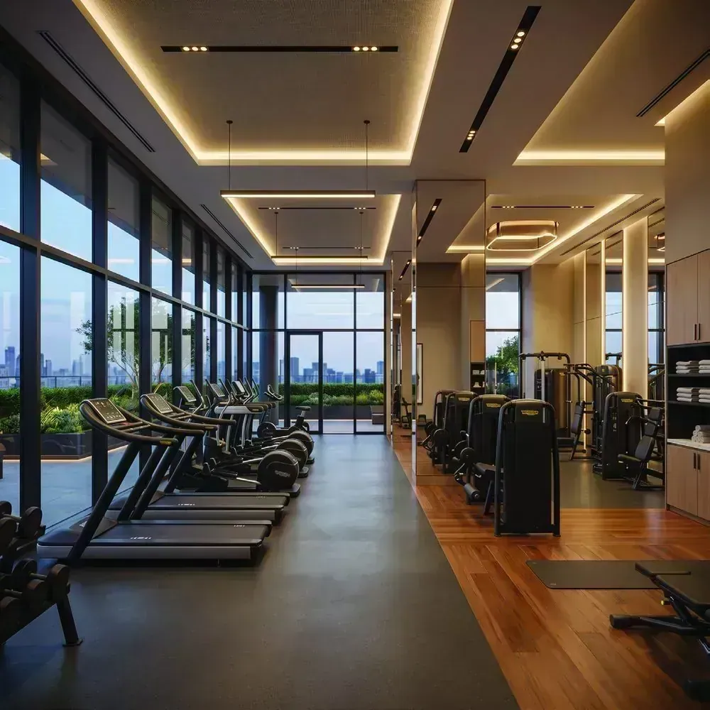 Gym with a row of treadmills along a glazed wall